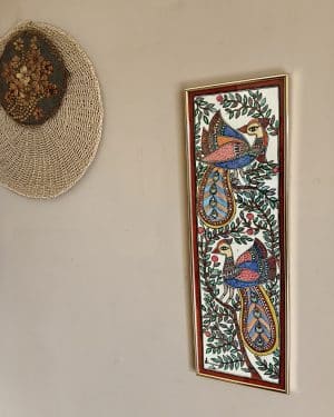 Beautiful peacock Madhubani painting with vibrant colors .